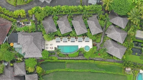 Aerial top down view of bali resort villas and swimming pool Stock Footage 328912760