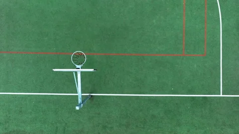 Aerial Top Down View Of Basketball Hoop On Green Outdoor Court Stock Footage 337728296