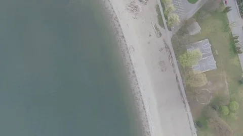 Aerial top down view of beach and basketball court Stock Footage 70998844