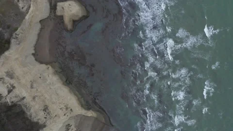 Aerial top down view of the beach of the Pacific Ocean Stock Footage 146754746