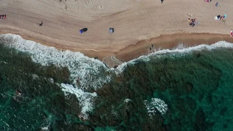 Aerial top down view of a beach with vawes Stock Footage 172436686