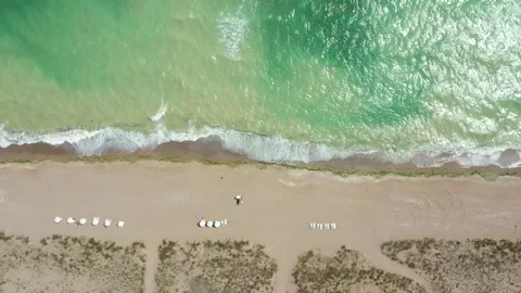 Aerial top down view of the beach without people on a hot sunny day Stock Footage 194670938
