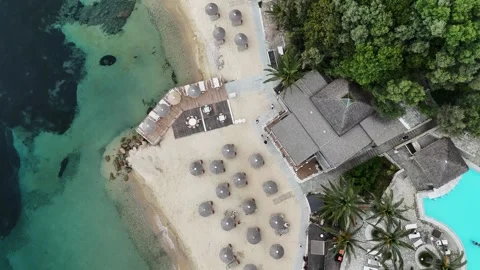 Aerial top down view of beach resort with sun umbrellas in Greece Stock Footage 327653464