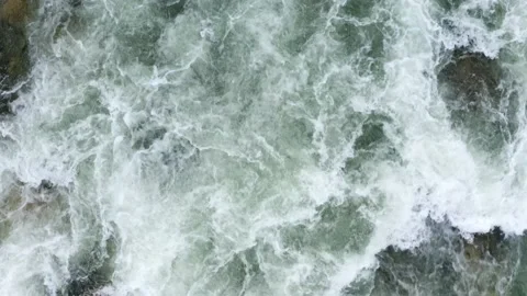 Aerial top down view, a beautiful pattern or background of a mountain river Vidéo 160323604
