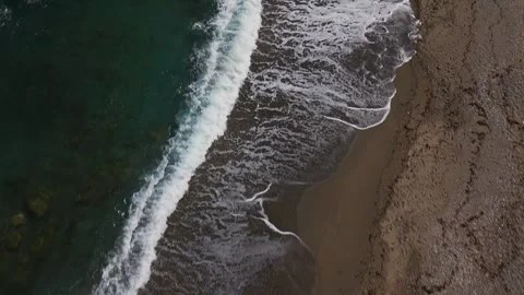 Aerial top down view of beautiful turquoise sea waves breaking on sand beach Stock Footage 257691399