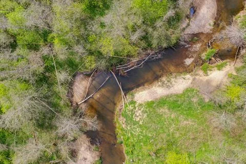 Aerial top down view of bend of the river in spring Stock Photos