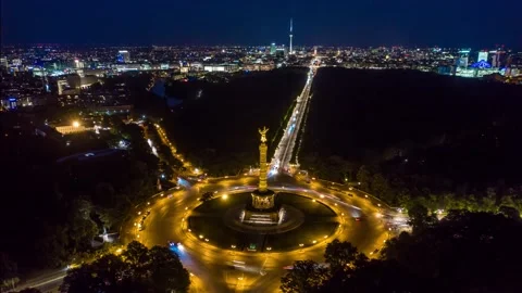 Aerial top down view of Berlin Victory Column roundabout traffic at night Stock Footage 146256571