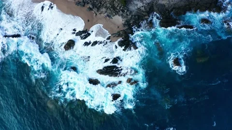 Aerial top down view of big vawes on beach Stock Footage 172436653