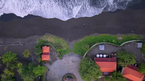 Aerial Top Down View of Black Sand Beach and Turquoise Ocean Waves in Bali Video stock 335742848