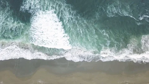 AERIAL Top-down view of blue ocean shallow water with waves rolling in Stock Footage 119699628