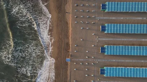 Aerial top down view blue beach resort at sunrise. Tidy rows, background patt Stock Footage 152269952