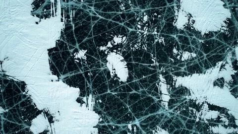 Aerial top down view on the blue cracked ice of the lake Baikal. Winter Video stock 154114916