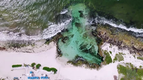 Aerial top-down view of blue lagoon and tropical beach resort. Blue sea waves Stock Footage 157366251
