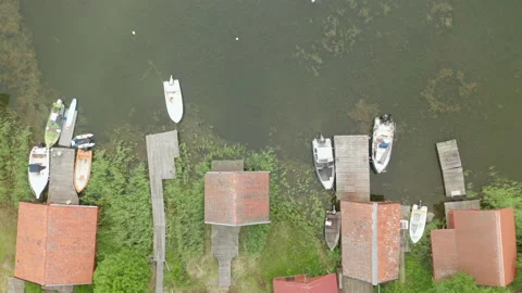 Aerial top down view of boathouses along shoreline in the archipelago Stock Footage 134981815