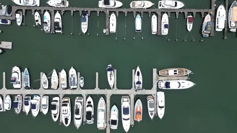 Aerial top down view of boats docked in a marina Stock Footage 337811502
