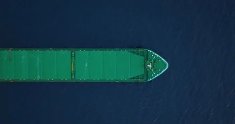 Aerial top down view of a bow from a large cargo ship traveling with speed over Stock-Footage 261700313