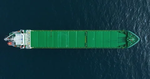 Aerial top down view of a bow from a large cargo ship traveling with speed over Stock-Footage 261973438