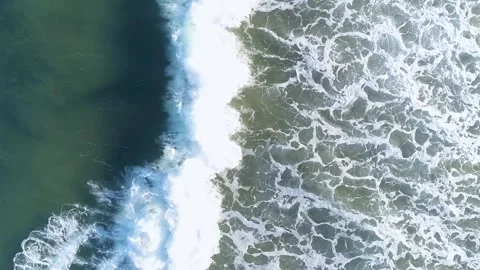 Aerial top down view of breaking ocean waves The Concept of Energy Video stock 327953280