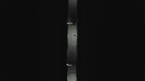 Aerial top down view of a bridge illuminated with white lights Video stock 146341251