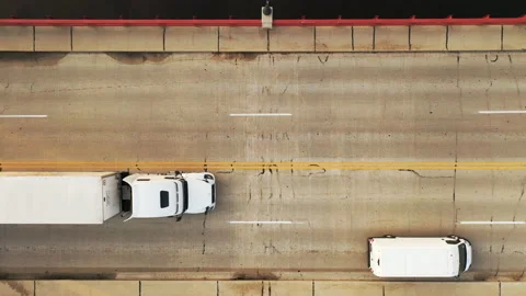 Aerial top down view a bridge road in a small city with moving driving cars Stock Footage 162813480