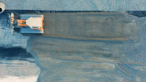 Aerial Top Down View of Bulldozer Leveling Gravel on Construction Plot, Land Stock Footage 294000623