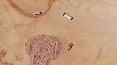 Aerial top down view of bulldozer and dump truck working in a quarry Stock-Footage 345007225