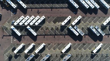 Aerial top down view of bus terminus 4k Stock Footage 85570197