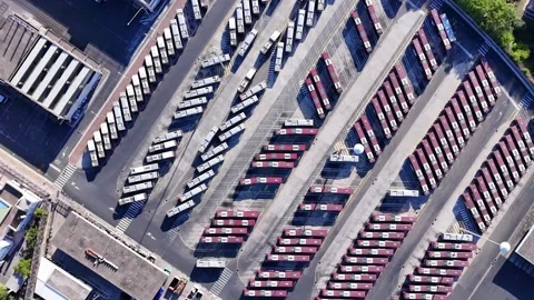 Aerial top down view of bus terminus is designated place where bus or coach Stock Footage 252270497