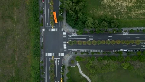 Aerial Top-Down View of Bus Turning at Three-Way Junction near Chiayi Station Stock Footage 309108630