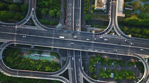 Aerial top down view of a busy junction reveals a multitude of vehicles Video stock 309792887