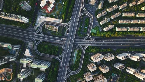 Aerial top down view of a busy junction reveals a multitude of vehicles 動画素材 311528148