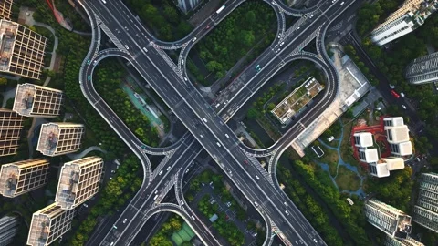 Aerial top down view of a busy junction reveals a multitude of vehicles Video stock 311528231