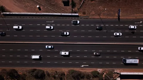 Aerial top down view of busy highway traffic flow Stock Footage 332299483