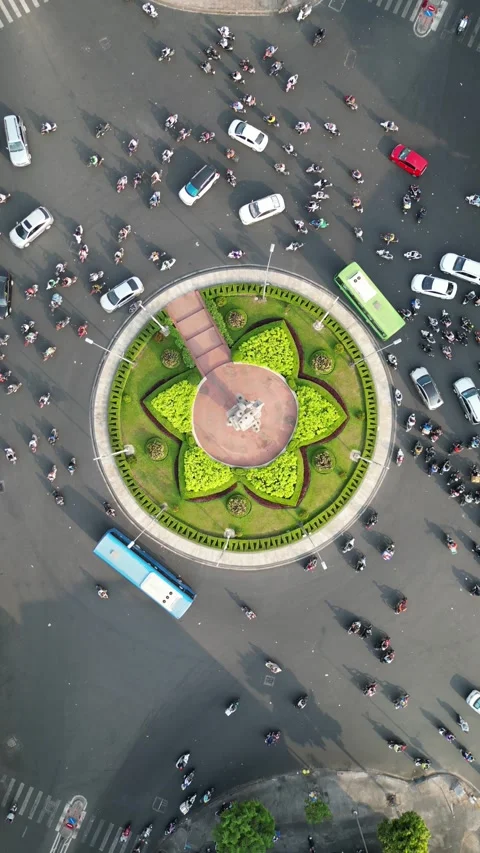 Aerial Top Down View of Busy Traffic Roundabout in Ho Chi Minh City, Vietnam Stock Footage 335575294