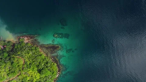 Aerial top down view of the calm and green lagoon with crystal clear water near Stock Footage 341661914