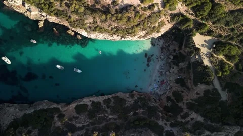 Aerial Top Down View of Calo des Moro Beach Bay with Turquoise Sea in Mallorca Stock Footage 284208747