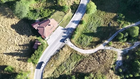 Aerial Top Down View of Camper Van Driving and Pulling Over on Roadside 動画素材 344032228