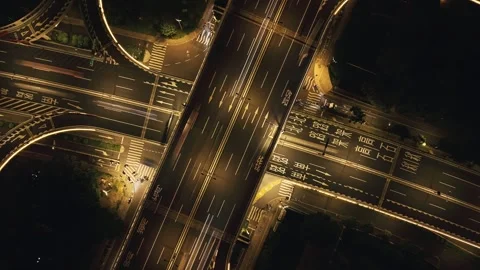 Aerial top down view captures a busy Hangzhou highway interchange at night with Stock Footage 340902125