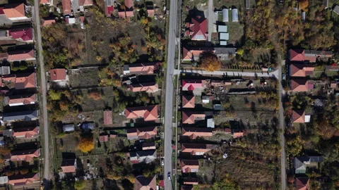 An aerial top down view captures a quiet residential neighborhood featuring Stock Footage 348420404