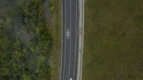 Aerial top down view car road and green forest with cloud Stock Footage 118723839