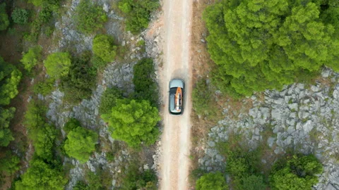 Aerial Top Down View Of Car Driving Offroad Gravel Dirt Road In Beautiful Nature Stock Footage