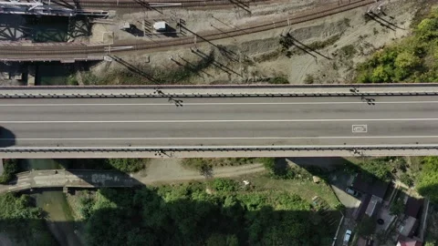 Aerial top down view car driving. Cinematic drone shot flying over road. Top 스톡 동영상 143904993