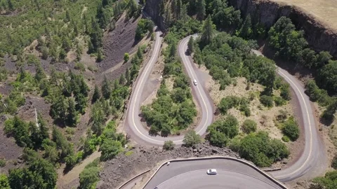 Aerial top down view car driving on a scenic horseshoe road in Oregon. Stock Footage 144862938