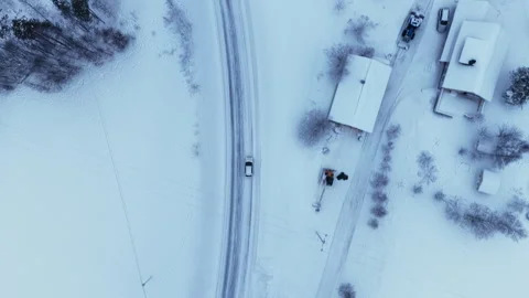 Aerial top down view of car driving on snowy road, Norway Vídeo Stock 340238719