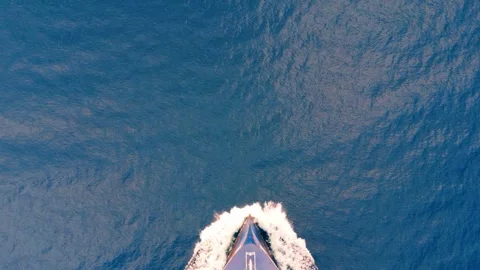 Aerial top-down view of cargo ship bow cutting water Stock Footage 335644565