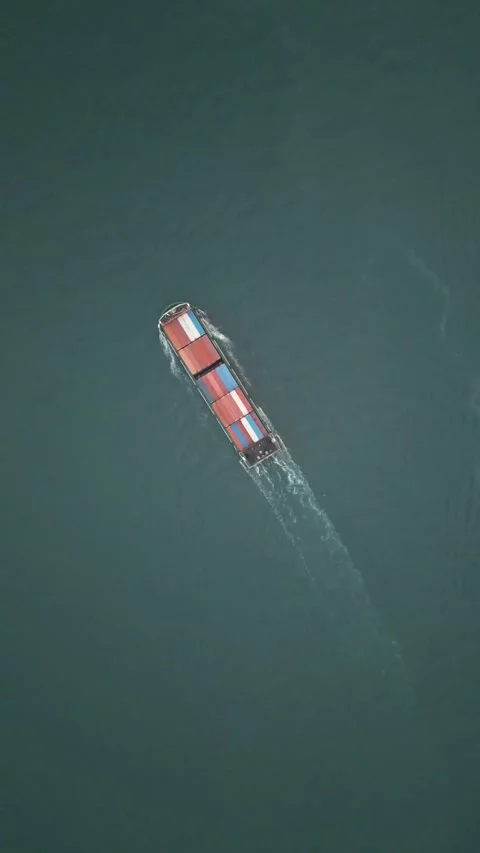 Aerial Top Down View of Cargo Container Ship Navigating Open Sea in Hong Kong Stock Footage 335811198