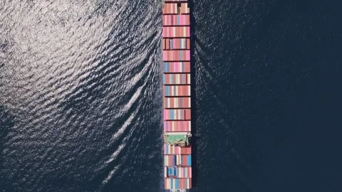 Aerial top down view of cargo container ship cruising the ocean Vídeos de archivo 336688114