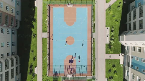 Aerial Top Down View of children playing soccer. Football field playground Video stock 132898744