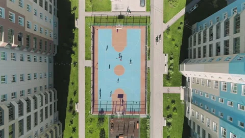 Aerial Top Down View of children playing soccer. Football field playground Stock-Footage 132968339