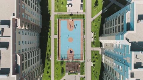 Aerial Top Down View of children playing soccer. Football field playground 库存影片 132973151